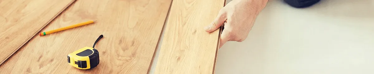A professional installing wood flooring in Shreveport, LA