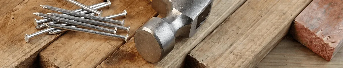 Hammer and nails on hardwood flooring boards in Shreveport, LA