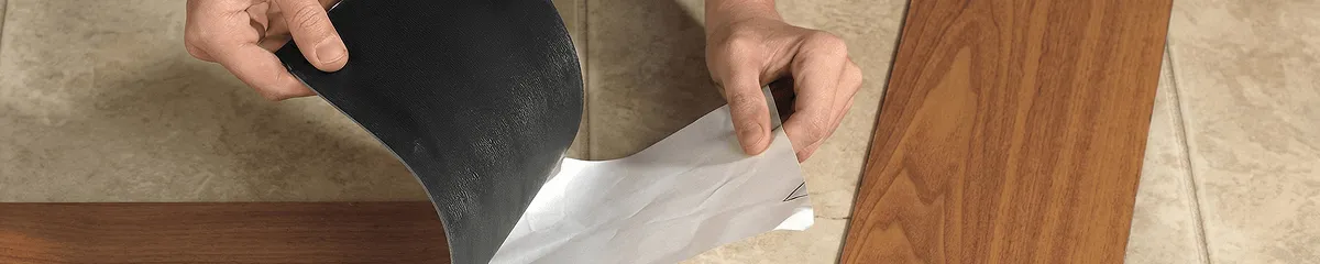 A professional installing vinyl flooring in Shreveport, LA